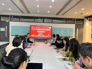 A group of people sitting at a table

Description automatically generated